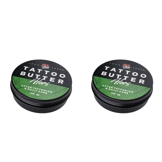 Two tins of Love Ink Tattoo Butter on a transparent background. Both tins are labeled 'Aloe' with a green design