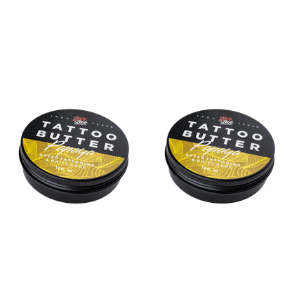 Two tins of Love Ink Tattoo Butter on a transparent background. Both tins are labeled 'Papaya " with an yellow design