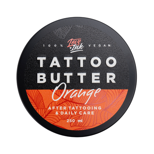 Top view of a 250ml jar of Tattoo Butter Orange by LoveInk. The sleek packaging highlights that it is 100% vegan and suitable for after tattooing and daily care.